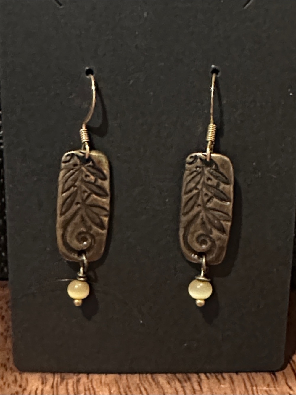 Handcrafted Leaf Motif Dangle Earrings in Antique Brass and Cream